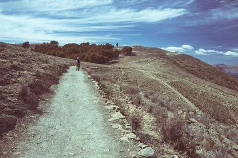 Backpacker exploring the majestic Inca Trails on Island of the Sun, Titicaca  Stock Photos