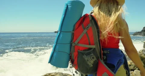 Backpacker Exploring Rocky Seaside Trail Stock Footage 323547576