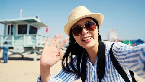 Backpacker having video phone call on smartphone Video stock 104583920