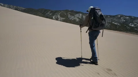 Backpacker Hiking with Determination in Sand Dunes National Park Video stock 106191413