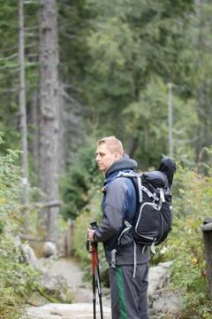 Backpacker hiking in mountains Stock Photos