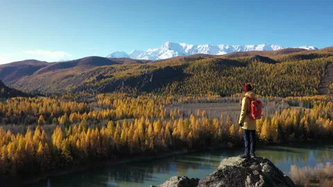 Backpacker Looking at the River Valley in Altai Mountains Stock Footage 143895552