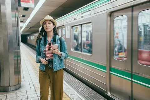 Backpacker looking up road information indicator Photos