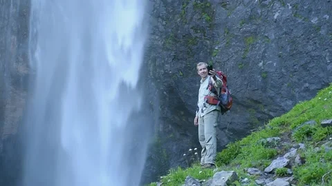 Backpacker Making Selfie With Beautiful Waterfall Stock Footage 246399607