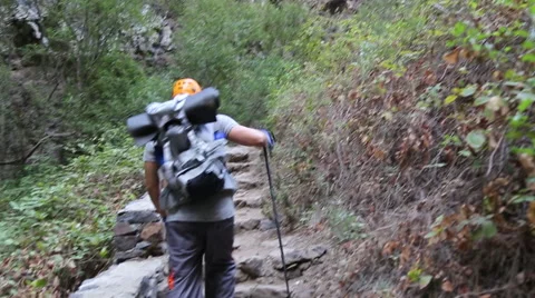 Backpacker man hiking in beautiful landscapes of Barranco del Infierno in Ten Stock Footage 68856416