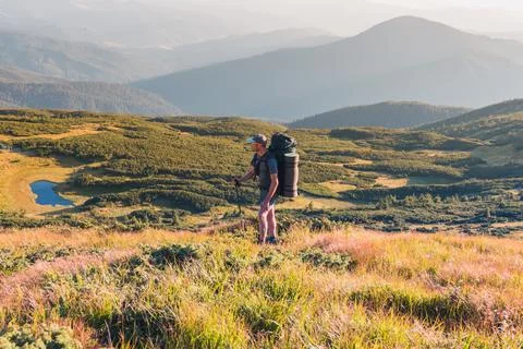 Backpacker in mountains Stock Photos