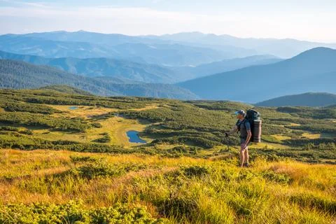 Backpacker in mountains Stock Photos