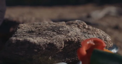 Backpacker Preparing And Slicing Ingredients On Mini Board Vídeo Stock 105258477