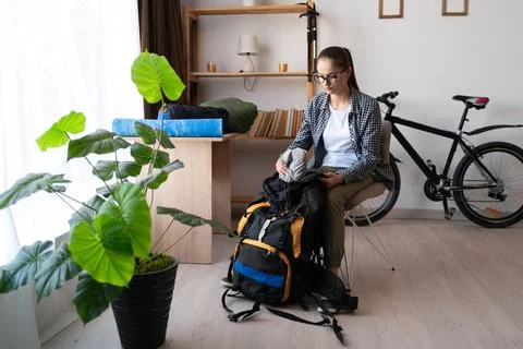 Backpacker preparing to trip. check the checklist for journey. Travel, hiking Stock Photos