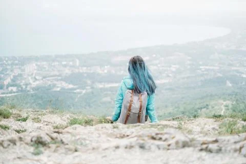 Backpacker resting on mountain Stock Photos