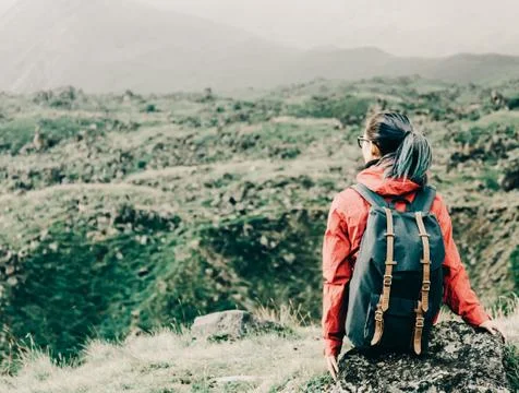 Backpacker resting in the mountains. Stock Photos