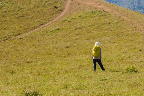 Backpacker standing on the mountain Stock Photos