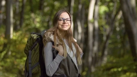 Backpacker Stands in Forest Видео 81132500
