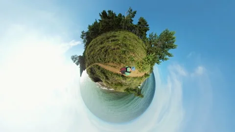 Backpacker Strolling Along a Scenic Tiny Planet Trail by the Ocean. Stock Footage 284912985