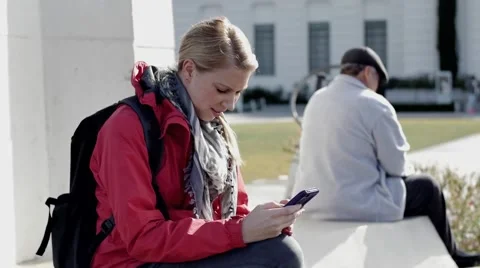 Backpacker texting Stock Footage 63313666