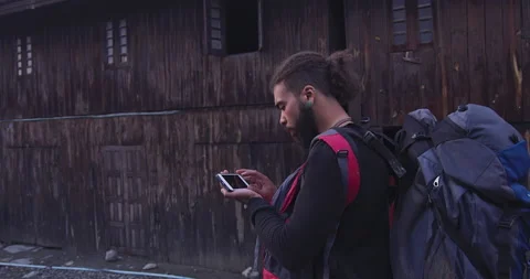 Backpacker tourist using a gps navigator on a smartphone in Myanmar, Traveling i Stock-Footage 201095787