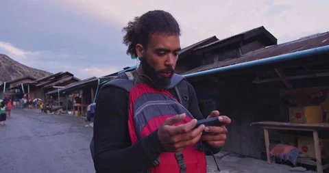 Backpacker tourist using a gps navigator on a smartphone in Myanmar, Traveling i Stock Footage 201096507