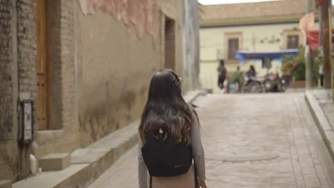 A backpacker travels alone and explores an ancient city Stock Footage 276227182