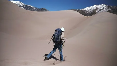 Backpacker Trudging Through Deep Sand in Sand Dunes National Park Video stock 106071587