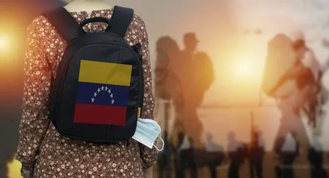Backpacker With Venezuela Flag Backpack At Sunset, Silhouettes Of People in Warm Stock Photos