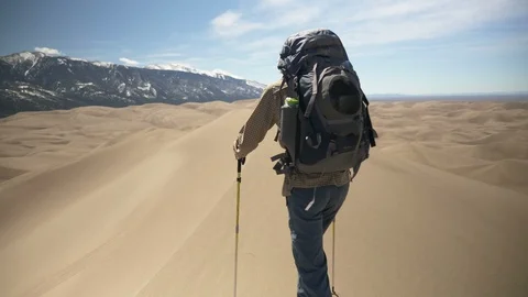 Backpacker Walking Amazing Dune Ridge-line in Sand Dunes National Park Video stock 106239902