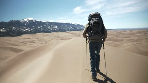 Backpacker Walking Sand Dunes Ridge Line in Sand Dunes National Park Video stock 106072115