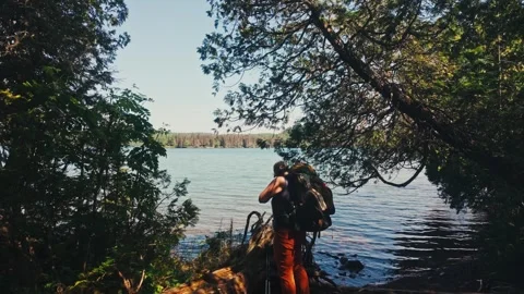 Backpacker by Water Stock Footage 344124667