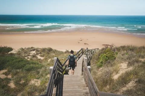 Backpacker on the way to the beach Stock Photos