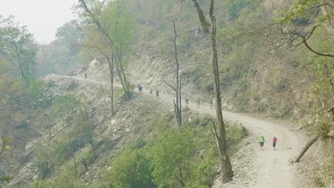 Backpackers on the alpine path on the Manaslu mountain circuit trek in Nepal. Stock Footage 91329027