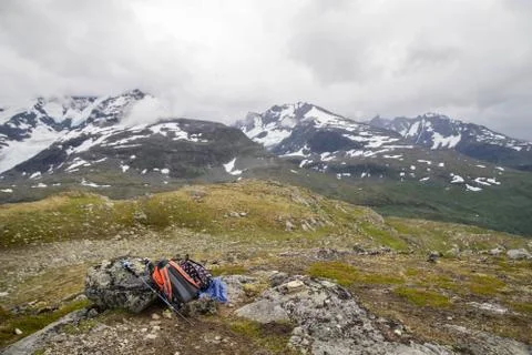 Backpacker's bag on top of mountain Stock Photos