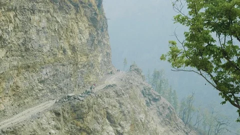 Backpackers with guide walk on the Manaslu mountain circuit trek in Nepal. Video stock 91329957