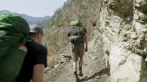 Backpackers on the nepalese path around the Manaslu mountain. Stock Footage 91540602