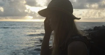 Backpacking and contemplating life at tropical beach during sunrise Stock Footage 86107437
