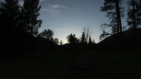 Backpacking tent in mountains while the sun sets Stock Footage 167301499