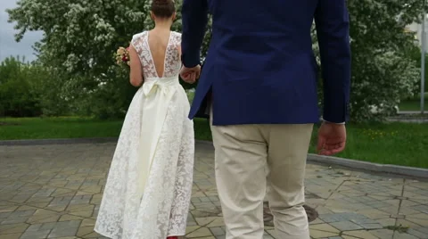 Backs of just married couple Stock Footage 61783481