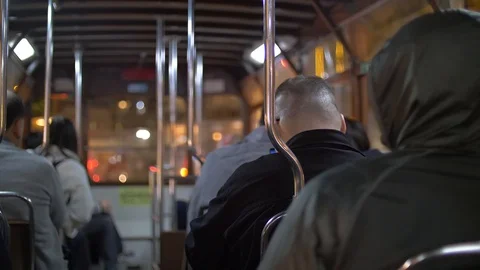 Backs of Passengers in a Tram at Nighttime 4k Stock Footage 123141594