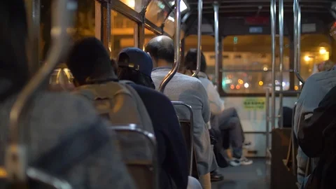 Backs of People commuting in a Tram at Nighttime 4k Stock Footage 123141443