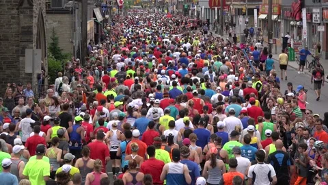 The backs of people running in a marathon. Stock Footage 139976584
