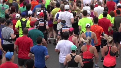 The backs of people running in a marathon. Stock Footage 139976968