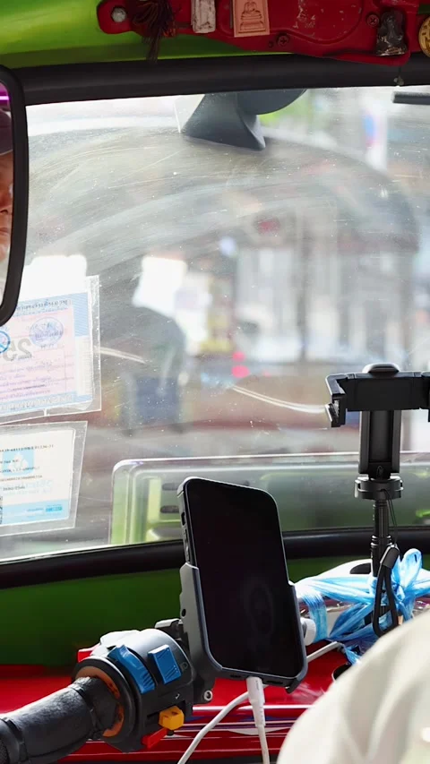 Backseat View of Tuk Tuk Driver in Bangkok Traffic Stock Footage 324685449
