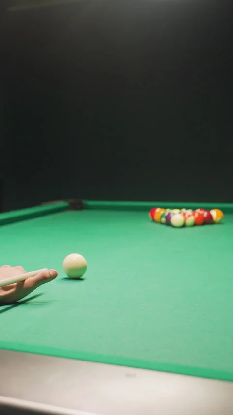 Backshot of Billiard Player Aiming Break Shot on Green Pool Table Stock Footage 319794069