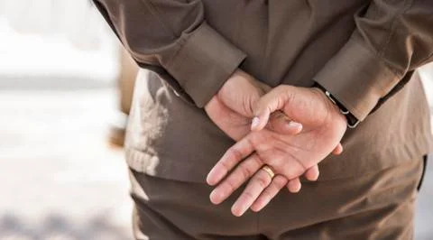 Backside of man in goverment uniform post Stock Photos