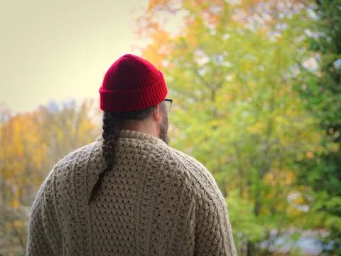 Backside selfie of man in a red beanie ja wool sweater Stock Photos