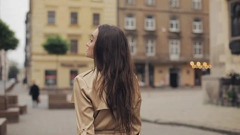 Backside Tracking Footage of Attractive Young Girl Walking othe Streets Looking Stock Footage 122747107