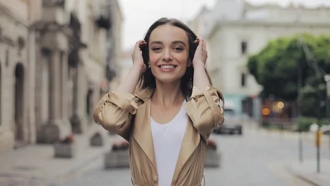 Backside Tracking Footage of Preety Young Girl Walking the Street Sweeping the Stock Footage 115911250