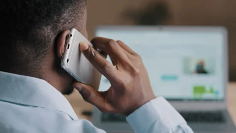 Backside unknown african american man young businessman web designer look at Stock Footage 197083315