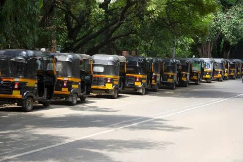 Backside view of Auto Rikshaws standing in queue on road, Pune, Maharashtr... Stock Photos