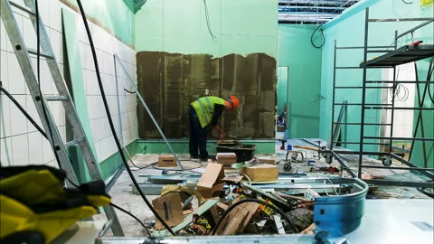 Backside view builders put tiles on store wall timelapse Stock Footage 94513093