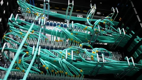 Backside view crypto servers connected with green wires Stock Footage 93778608