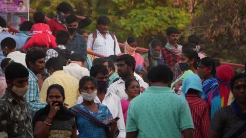 Backside view of Indian people walking on Indian streets Stock Footage 150738899